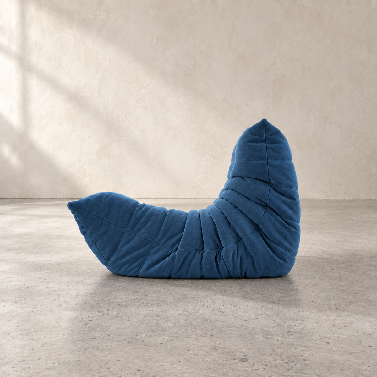 Low-profile sculpted FORMA armless lounge chair in faux suede for contemporary interiors
