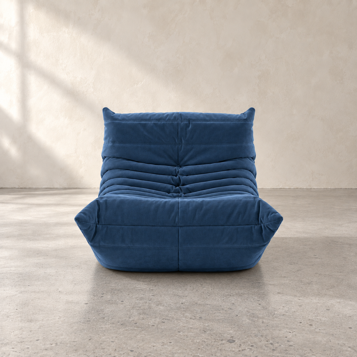 FORMA armless lounge chair with deep channel tufting in suede-style upholstery, modern sculptural seating