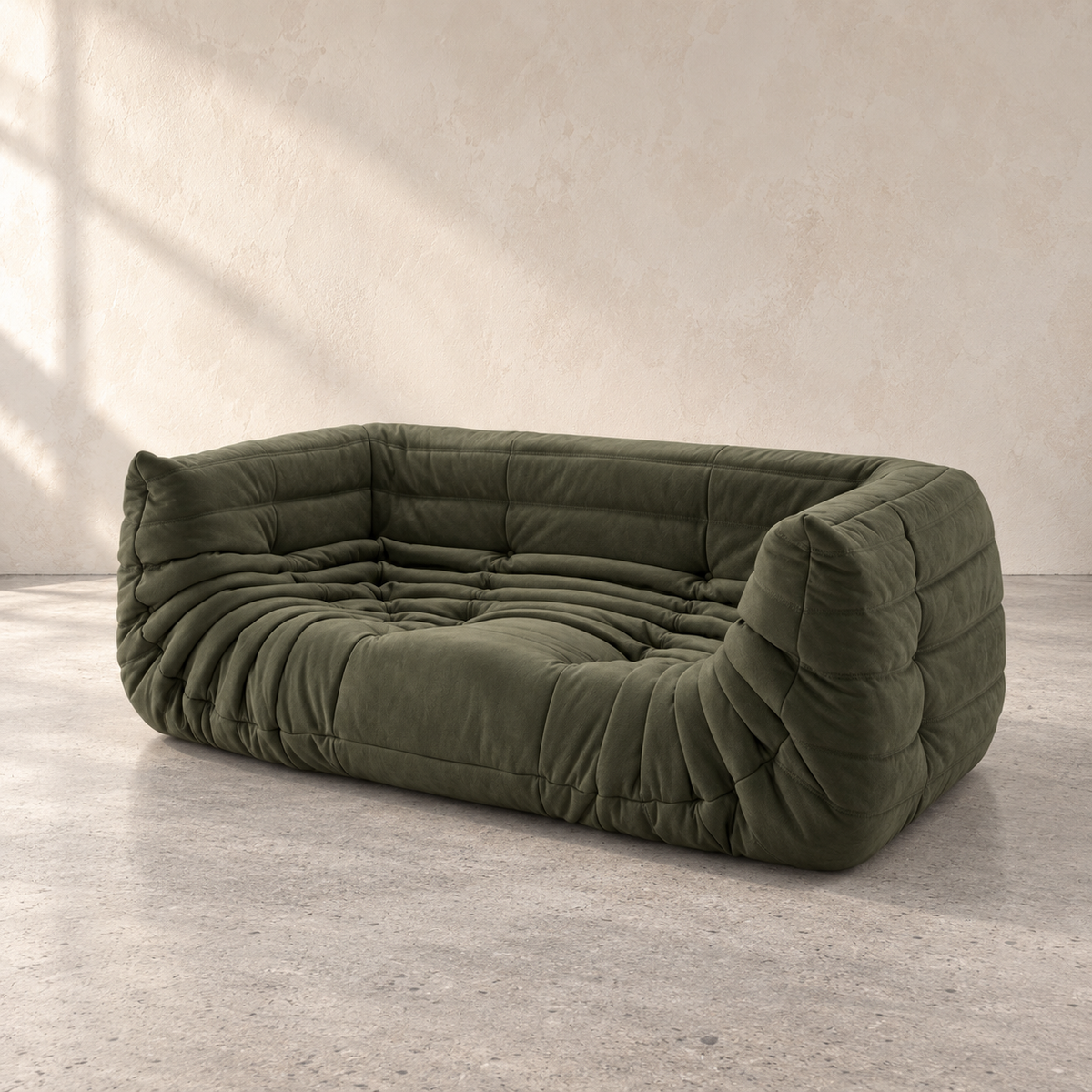 Olive green FORMA Lounge Sofa, designer low-profile sofa shown from a front three-quarter angle