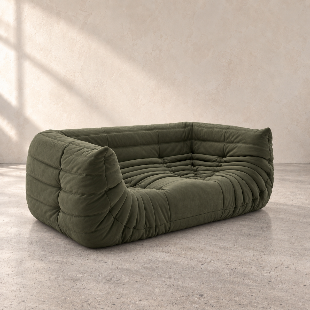 Side view of the olive green FORMA Lounge Sofa with plush channel tufting
